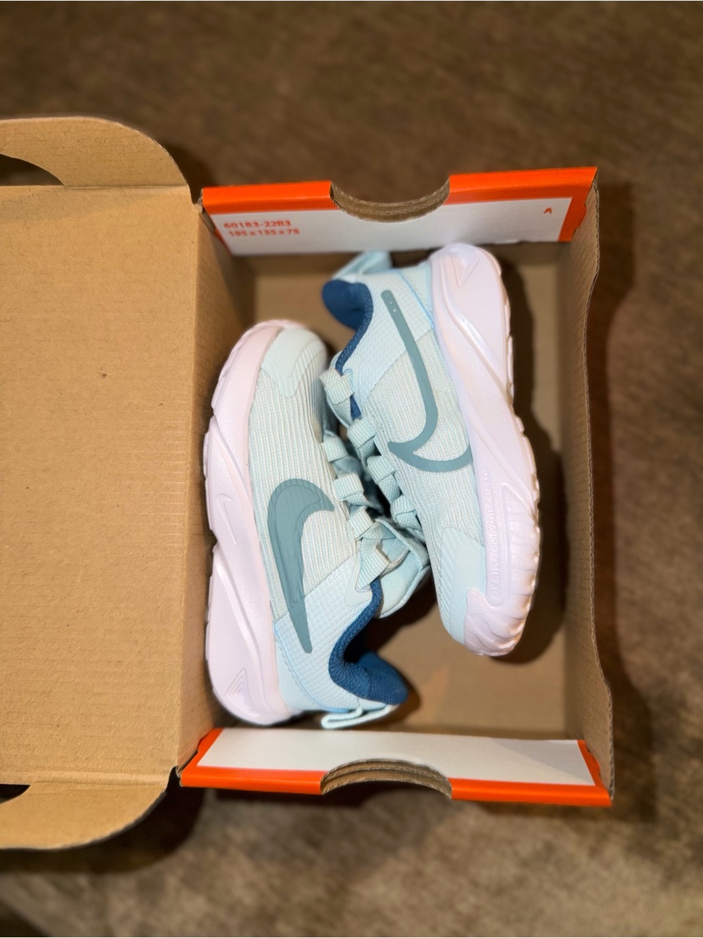 Nike Kids Light Blue Sneakers with Teal Swoosh